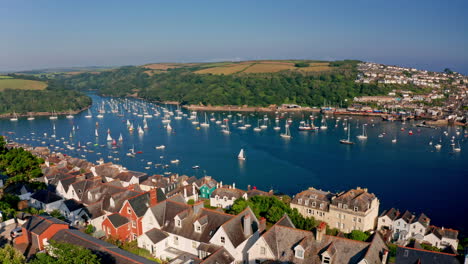 aerial drone shot over the beautiful coastline of fowey in cornwall, united kingdom