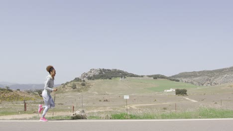 side view of woman running among nature