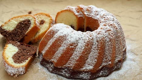 traditional homemade marble cake. sliced marble bundt cake on paper.