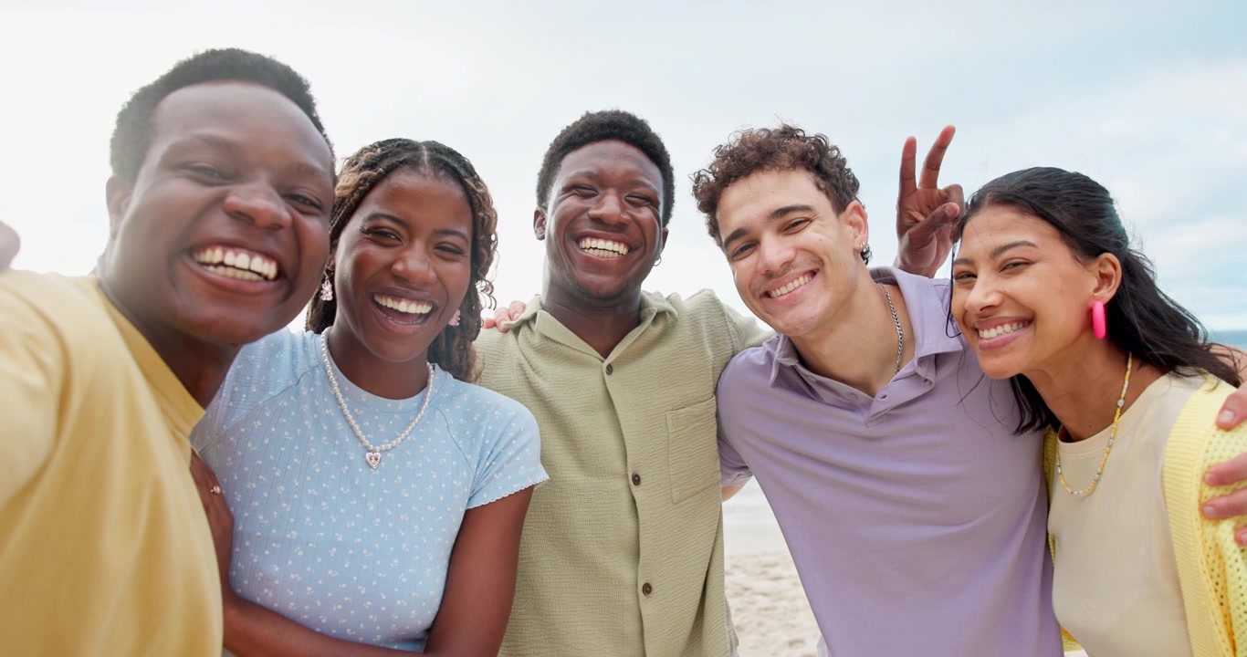 Group of Diverse Young Friends Taking a Selfie on the Beach