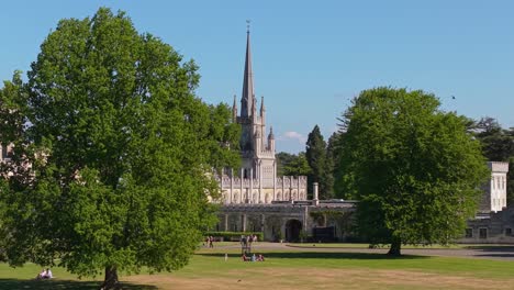 revealing the historic ashridge house in the background, framed by lush green trees in the foreground