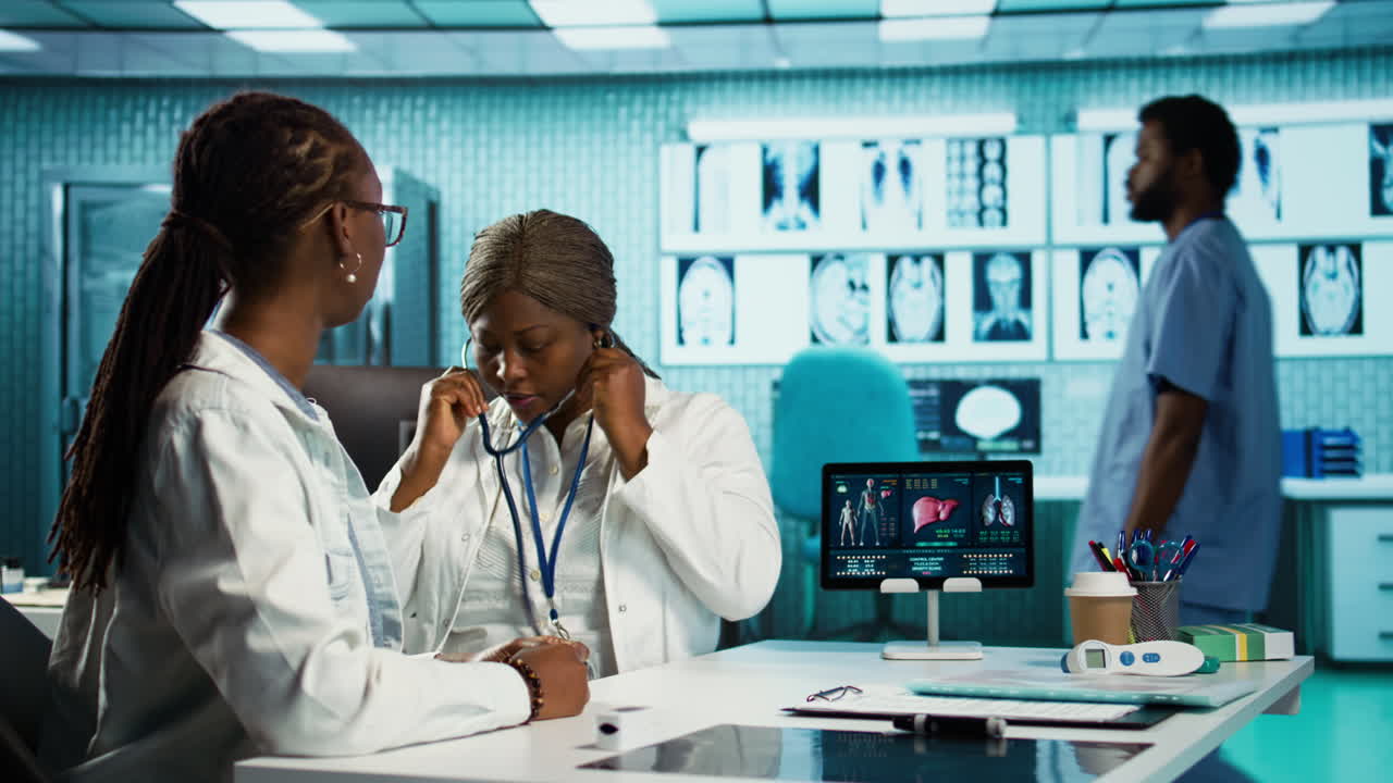 African american female medic does a respiratory consultation with stethoscope