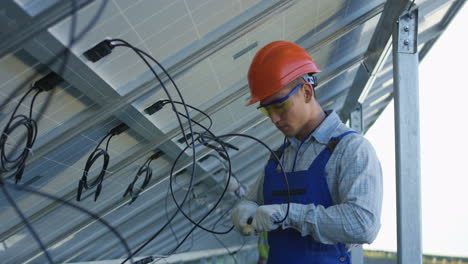 solar panel technician working on installation