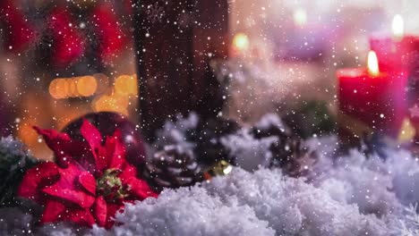 Candles-and-christmas-decoration-outside-a-window-combined-with-falling-snow