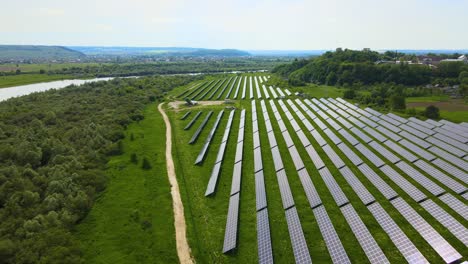 aerial view of big sustainable electric power plant with many rows of solar photovoltaic panels for producing clean ecological electrical energy. renewable electricity with zero emission concept