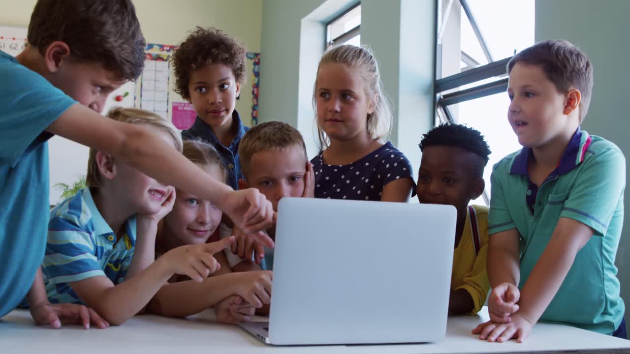 Group of kids using laptop in the class
