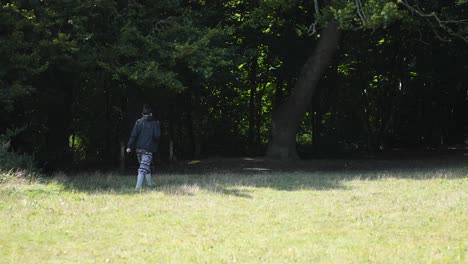 individual strolling through a grassy field