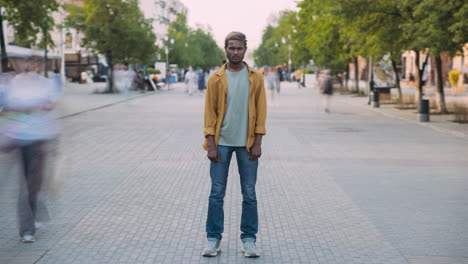 man standing on a city street