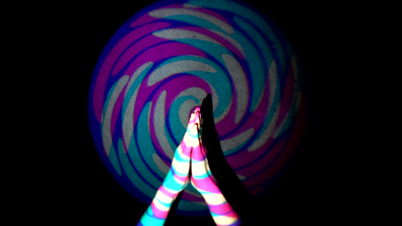 The human hand is applauding on background of colorful tunnel flythrough loop