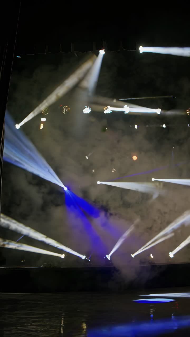 Dynamic stage lights with fog create a vibrant atmosphere