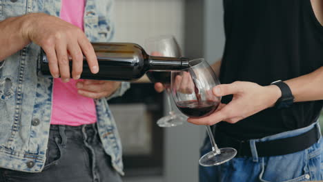 two men sharing wine