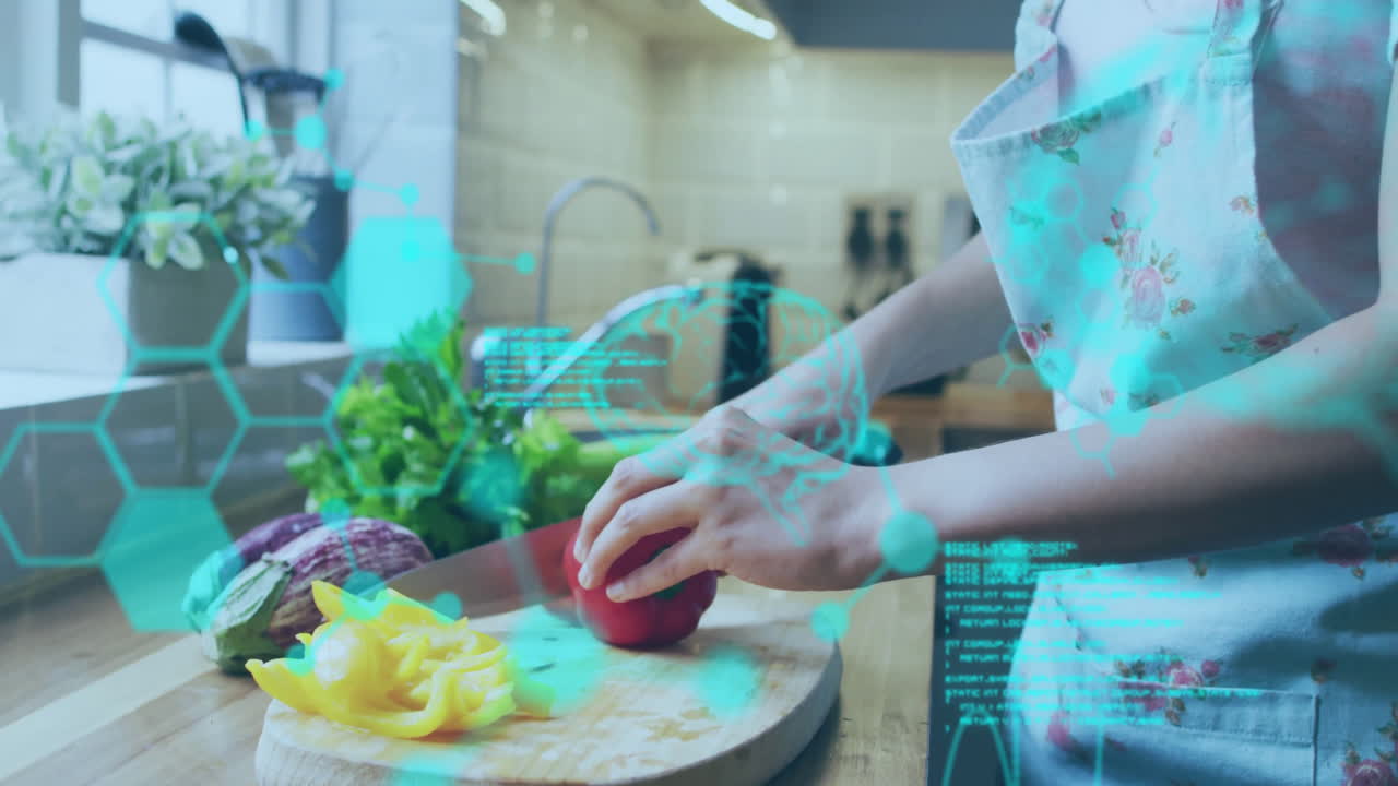 woman chopping vegetables in kitchen, displaying hexagonal interface and cooking tech