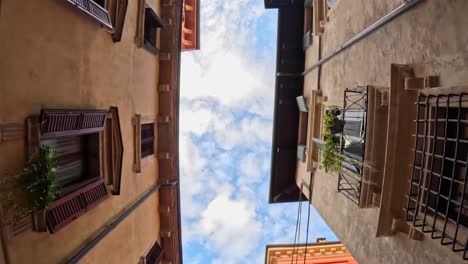 classic italian windows and balconies viewed from street in verona old town