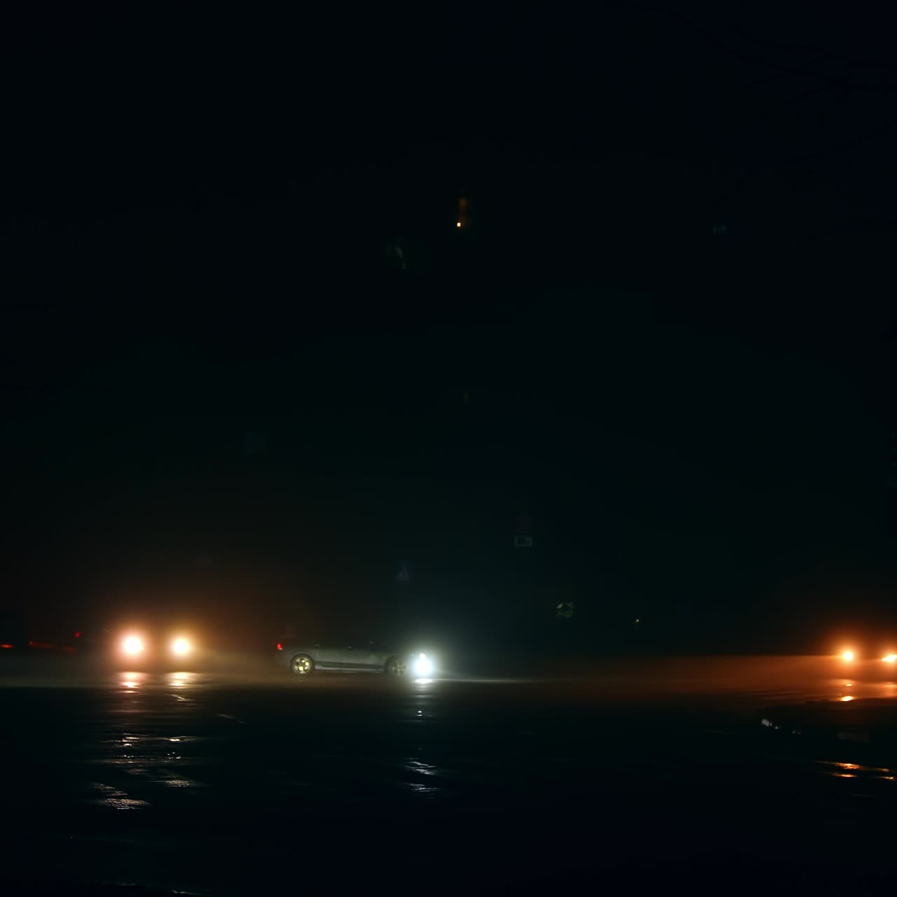 People cross the roads at the crossings with no traffic lights when there is no light in the city. Energy crisis resulting in power outages