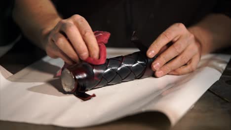 polishing a braided leather knife handle