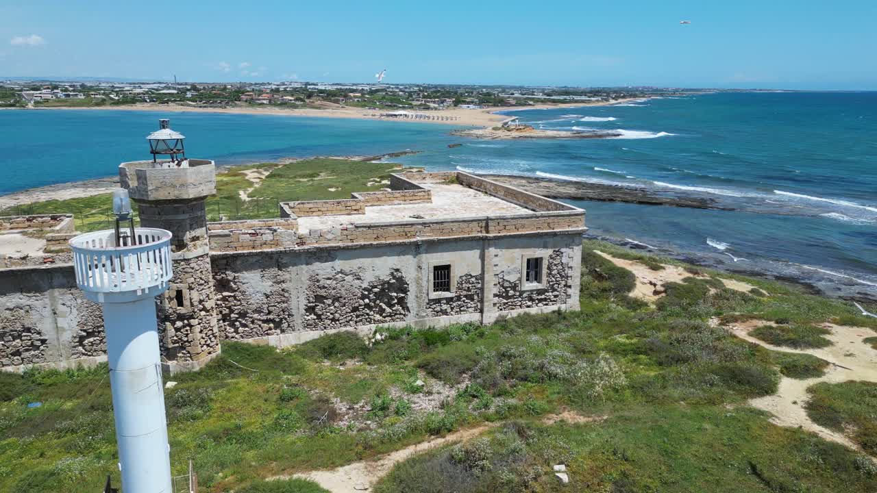 Aerial drone footage of Isola delle Correnti, Sicily: southernmost point of Italy where Ionian and Mediterranean seas meet. Perfect for travel, nature, and cinematic seascape projects