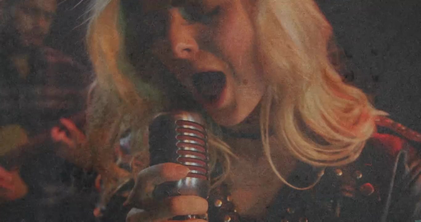 Female vocalist moving vintage mic, camera pulling back, singing, conveying emotional music