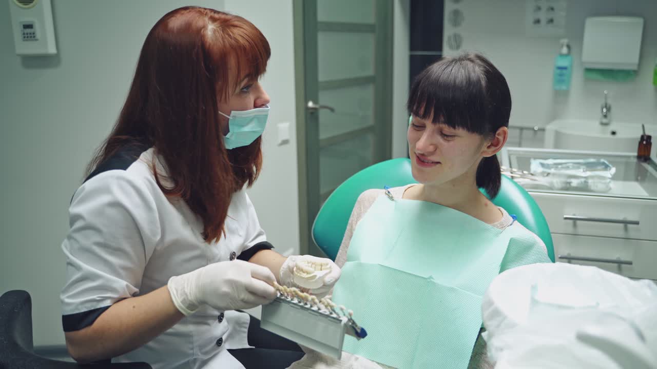 Dentist and patient in dentist office. Dental clinic.