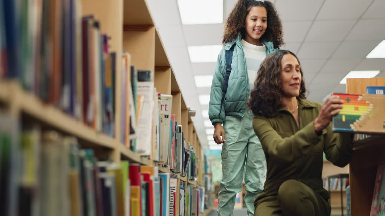 Woman and child in a library looking at books