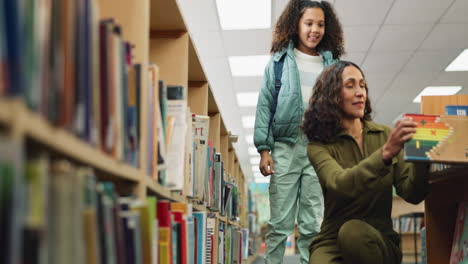 woman and child in a library looking at books