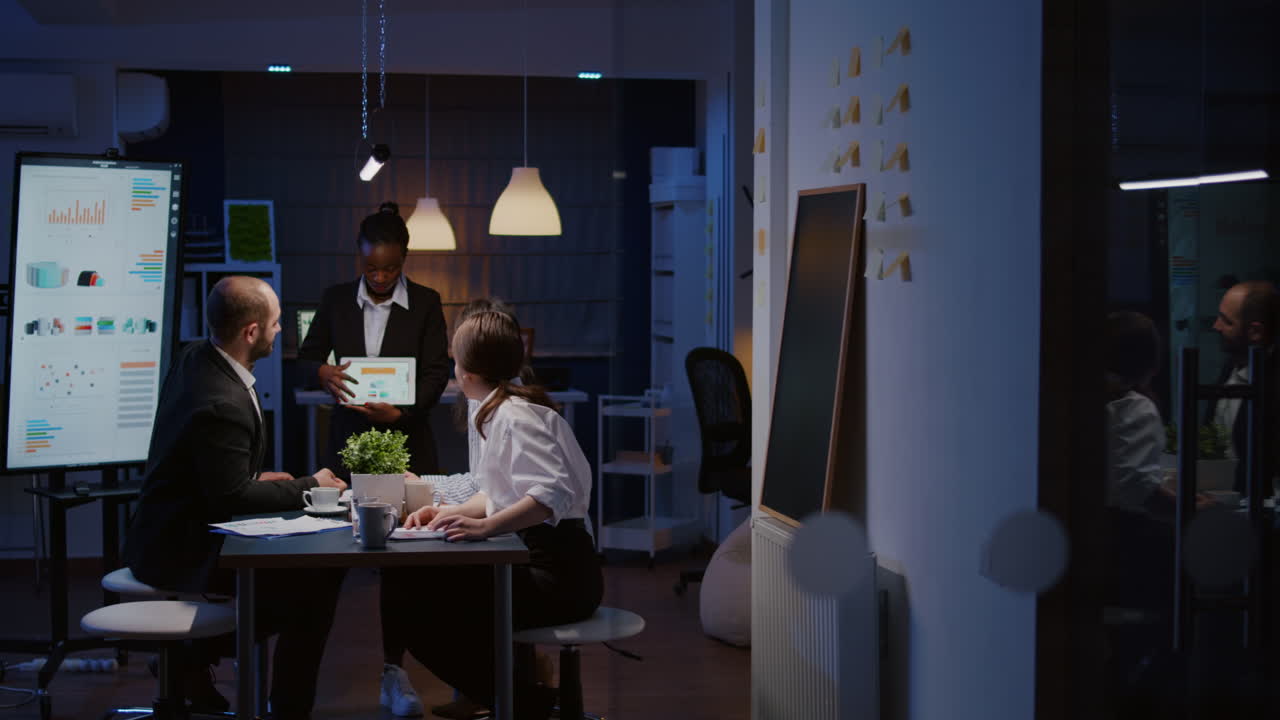 Overworked workaholic businesswoman with dark skin explaining management graphs