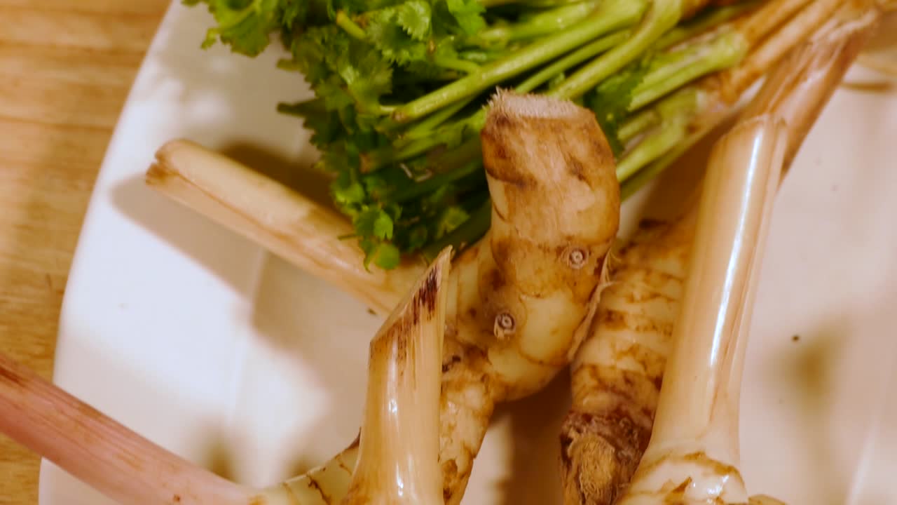 Galangal and Coriander Root on White Plate, Close Up-2
