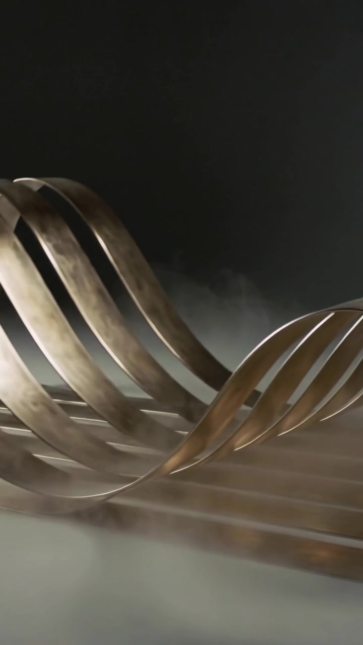Vertical video: Unwinding bronze ribbons lifting and rippling across studio slat base, mist glowing