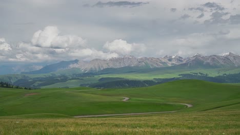 mountain peaks and grassland. time-lapse photography in kalajun grassland, xinjiang, china.