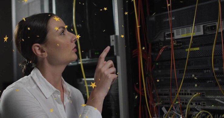 Datacenter tech touching chin, scanning cables, pointing yellow cable reseating golden star overlay