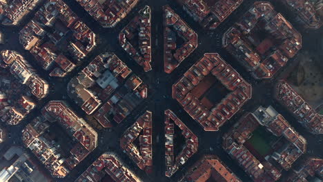 Fly-above-historic-Avinguda-Gaudi-and-surrounding-streets-and-blocks-of-buildings.-Top-down-shot-of-town-development-at-golden-hour.-Barcelona,-Spain