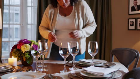 woman setting a festive dinner table