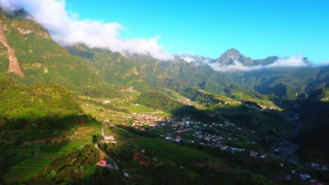 spectacular green rocks surround the picturesque village. amazing scenery of the madeira islands, portugal from top perspective.
