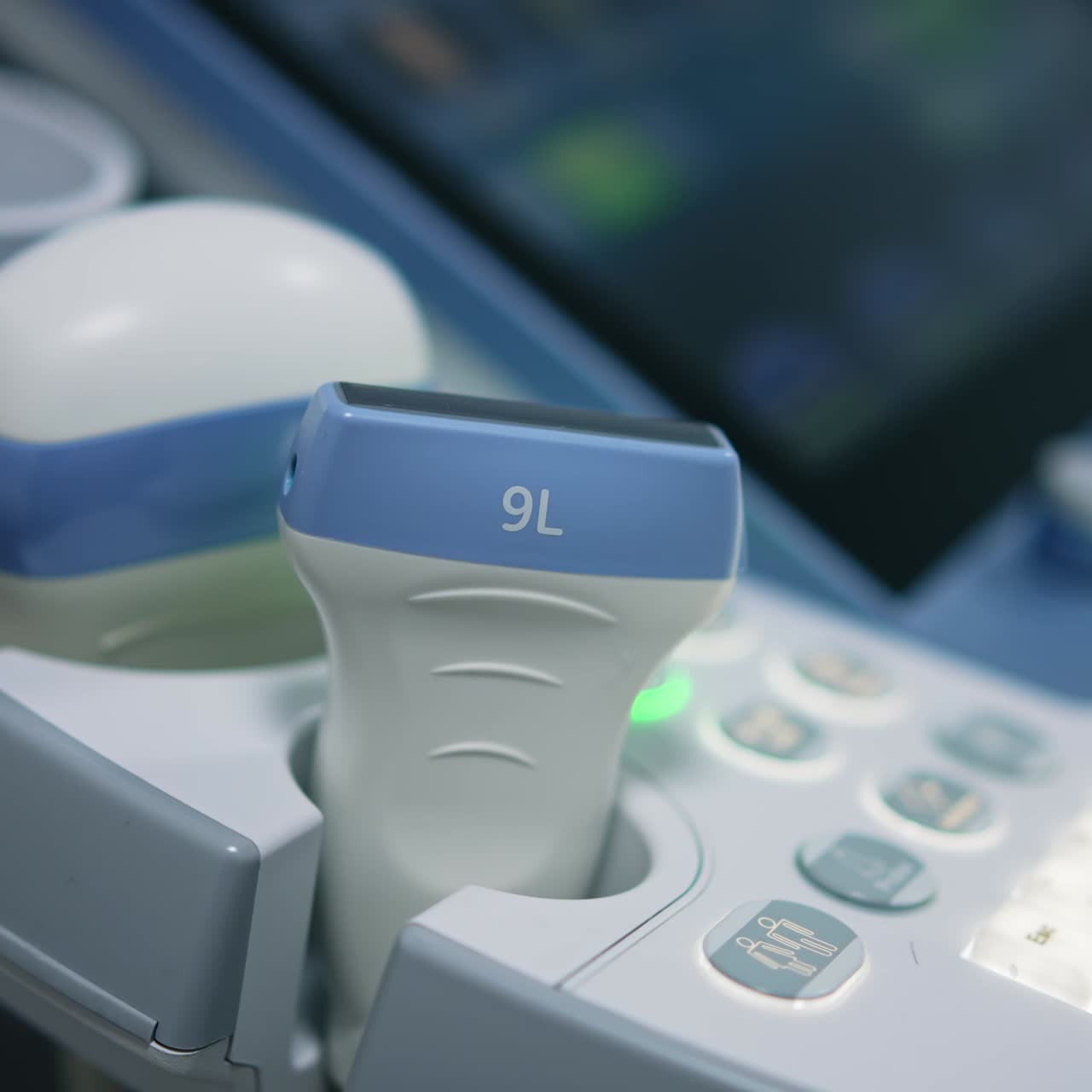 Various transducers on the sonography machine. Close up. System control panel of modern ultrasound equipment at backdrop in blur