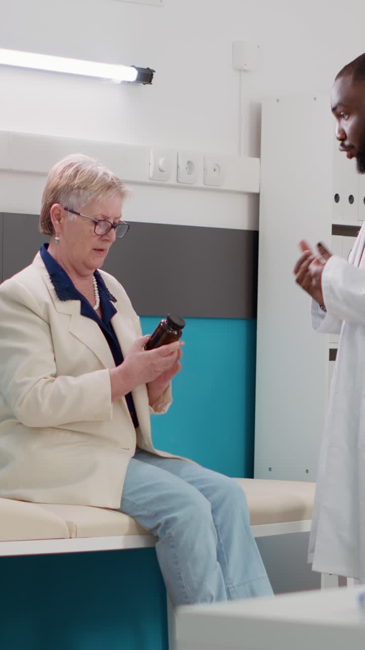 Doctor consulting with elderly patient in clinic