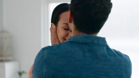 Woman,-man-and-kiss-on-forehead-in-home-for-love