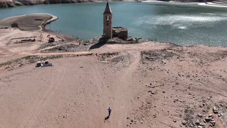 Resurfaced-11th-century-church-in-Sau-reservoir,-Catalonia,-Spain,-aerial