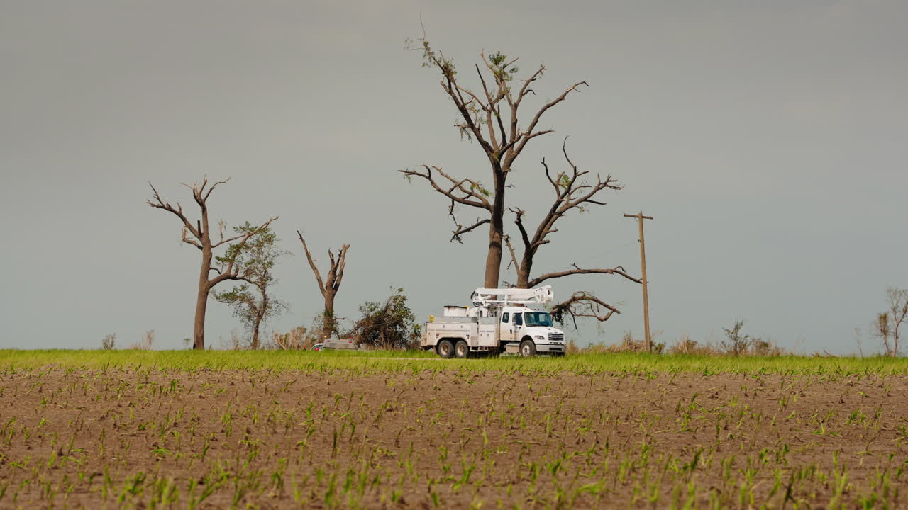 Emergency Vehicles Attend Site of Storm and Tornado Damage
