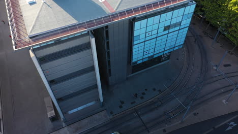 Exterior-modern-building-aerial-view-with-tramway-passing-Antigone-Montpellier