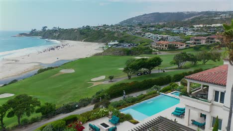 aerial view of monarch beach golf course and the beach over a swimming pool and walking trail