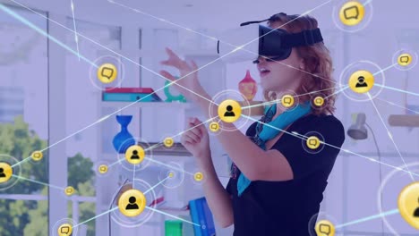 Animation-of-network-of-connections-with-icons-over-caucasian-businesswoman-using-vr-headset