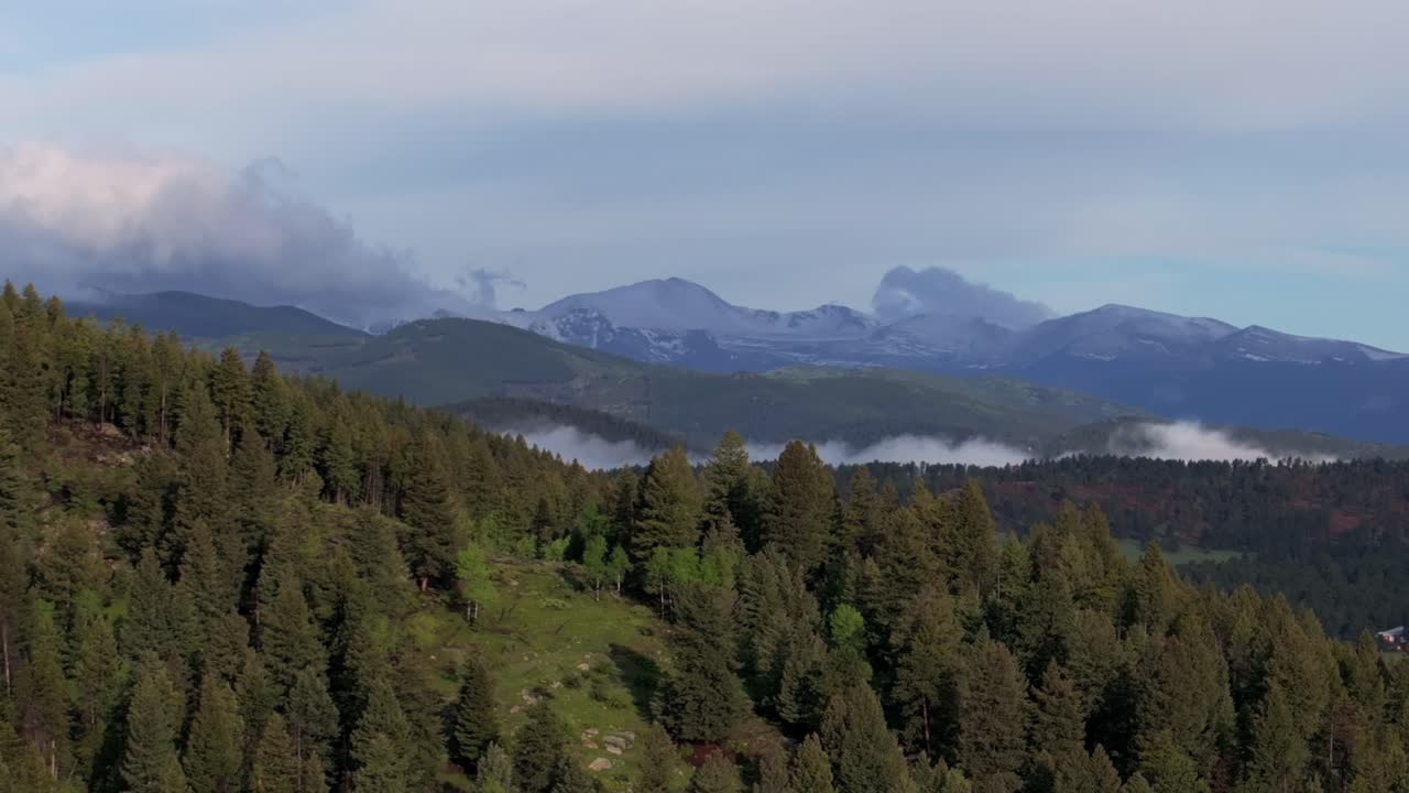 Foggy morning Front Range Rocky Mountains Mount Blue Sky Evans foothills valley of Evergreen Colorado aerial drone summer spring Conifer Bailey Arapaho National Forest hillside sunny cloudy left
