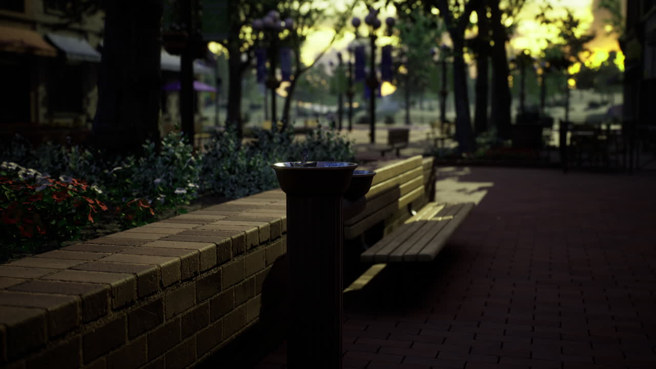 Quiet urban park benches with nature and sunset glow in the background
