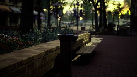 quiet urban park benches with nature and sunset glow in the background