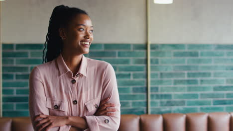 Portrait-Of-Smiling-Female-Owner-Or-Staff-Working-In-Cafe-Or-Coffee-Shop