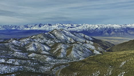 Drone-shot-of-snowy-mountains-in-the-Bristolcone-Ancient-Pine-Forest,-Bishop,-USA