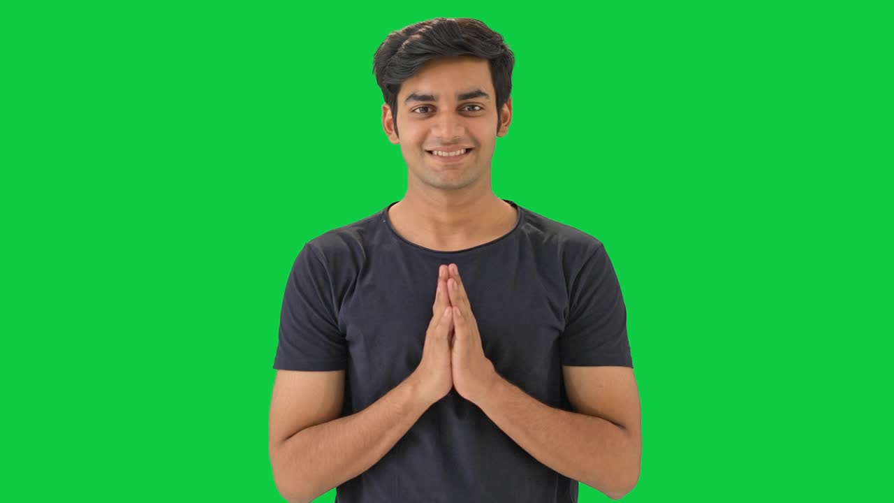 Cute Indian boy doing Namaste Green screen