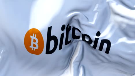 bitcoin_text flag waving in wind slow motion animation . 4k realistic fabric texture flag smooth blowing on a windy day continuous seamless loop background.