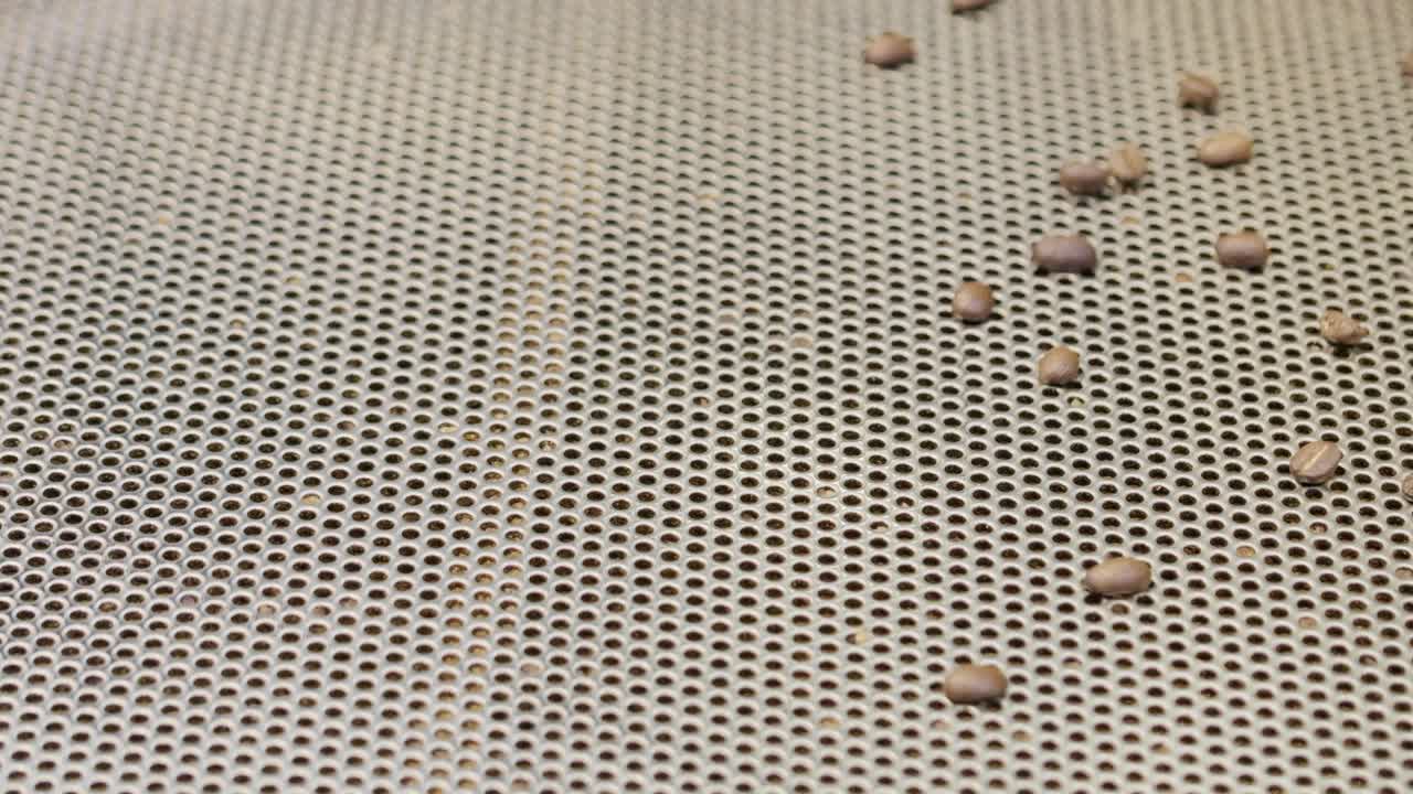 Explore the intricate process of coffee roasting showcasing the transformation of raw beans into an aromatic drink.