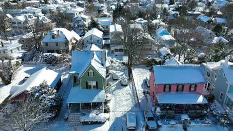 Charming-cute-Victorian-homes-in-USA-town-covered-in-fresh-winter-snow