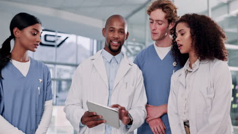 medical team reviewing patient data on tablet